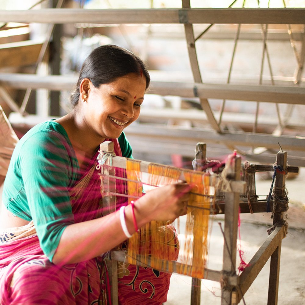 Women weaving fabrics